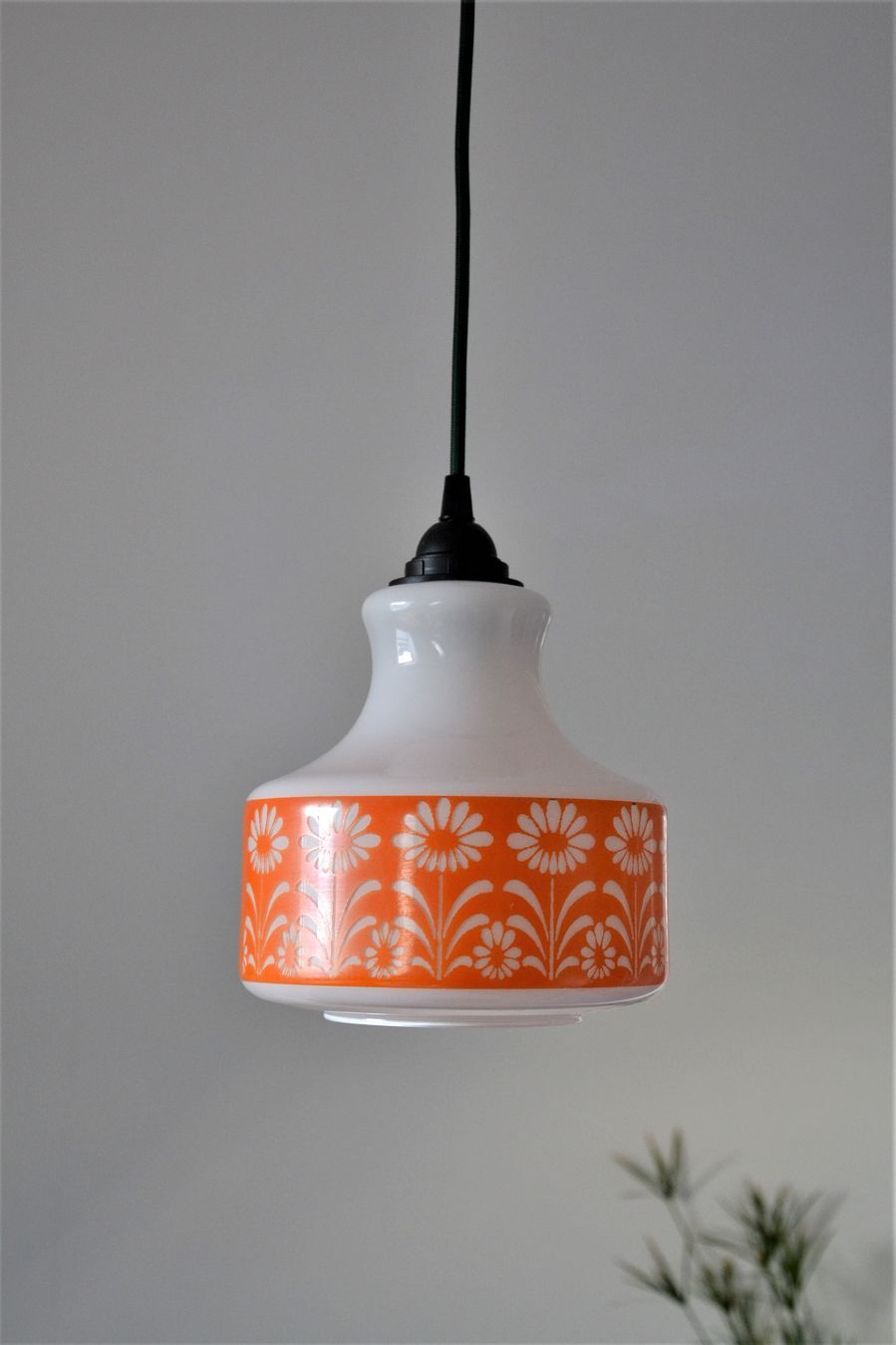 Seventies chandelier in white opaline decorating orange flowers