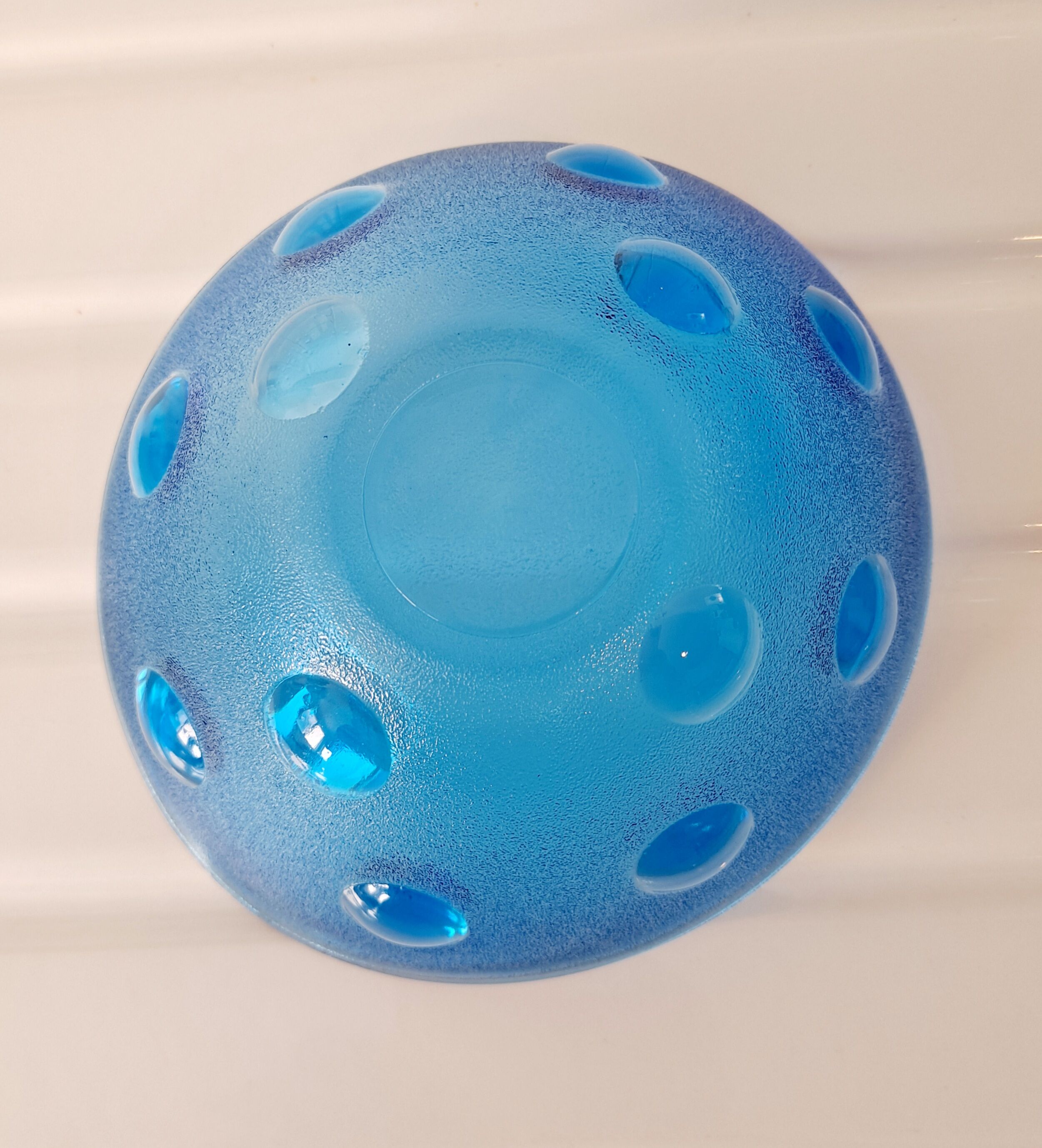 Empty cup blue glass pocket