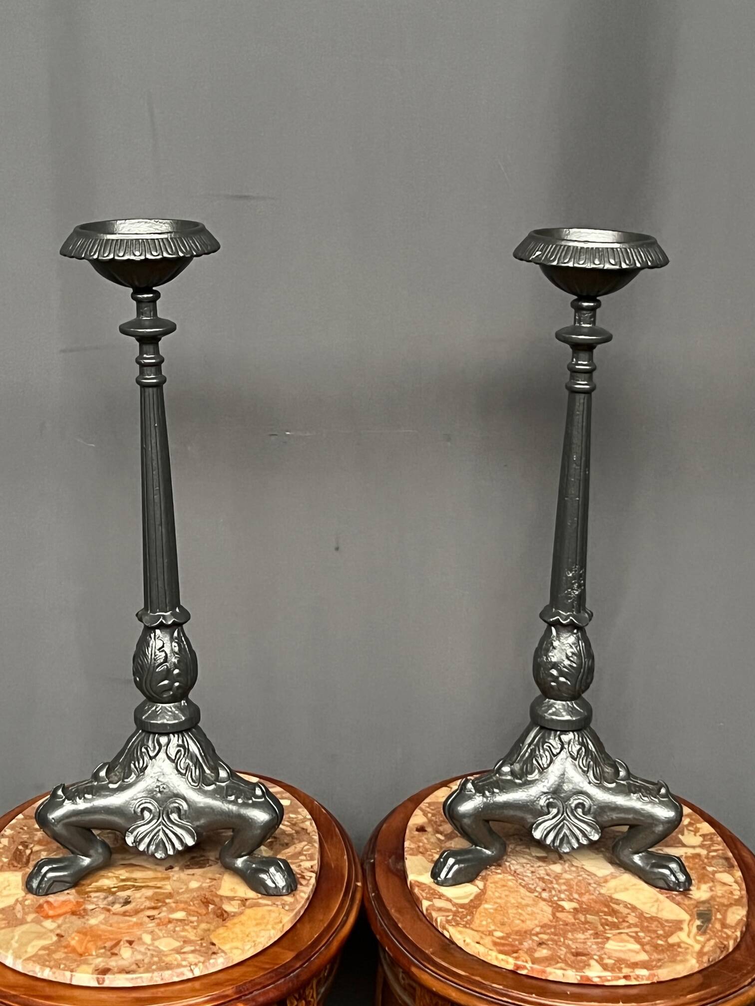 Pair of massive cast iron candlesticks in Renaissance style.