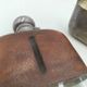 Silver-plated metal flask with leather and glass
