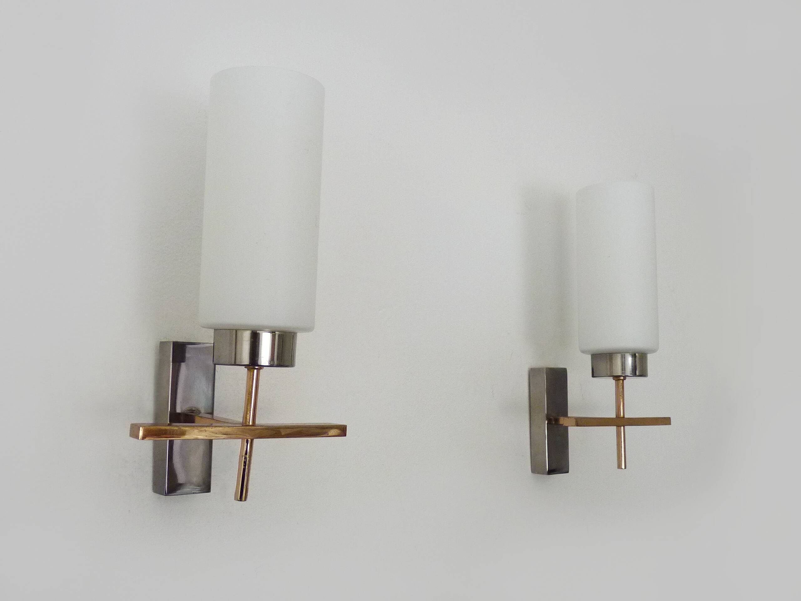 Pair of chrome-plated metal and opaline brass wall lights. 1960s