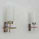 Pair of chrome-plated metal and opaline brass wall lights. 1960s