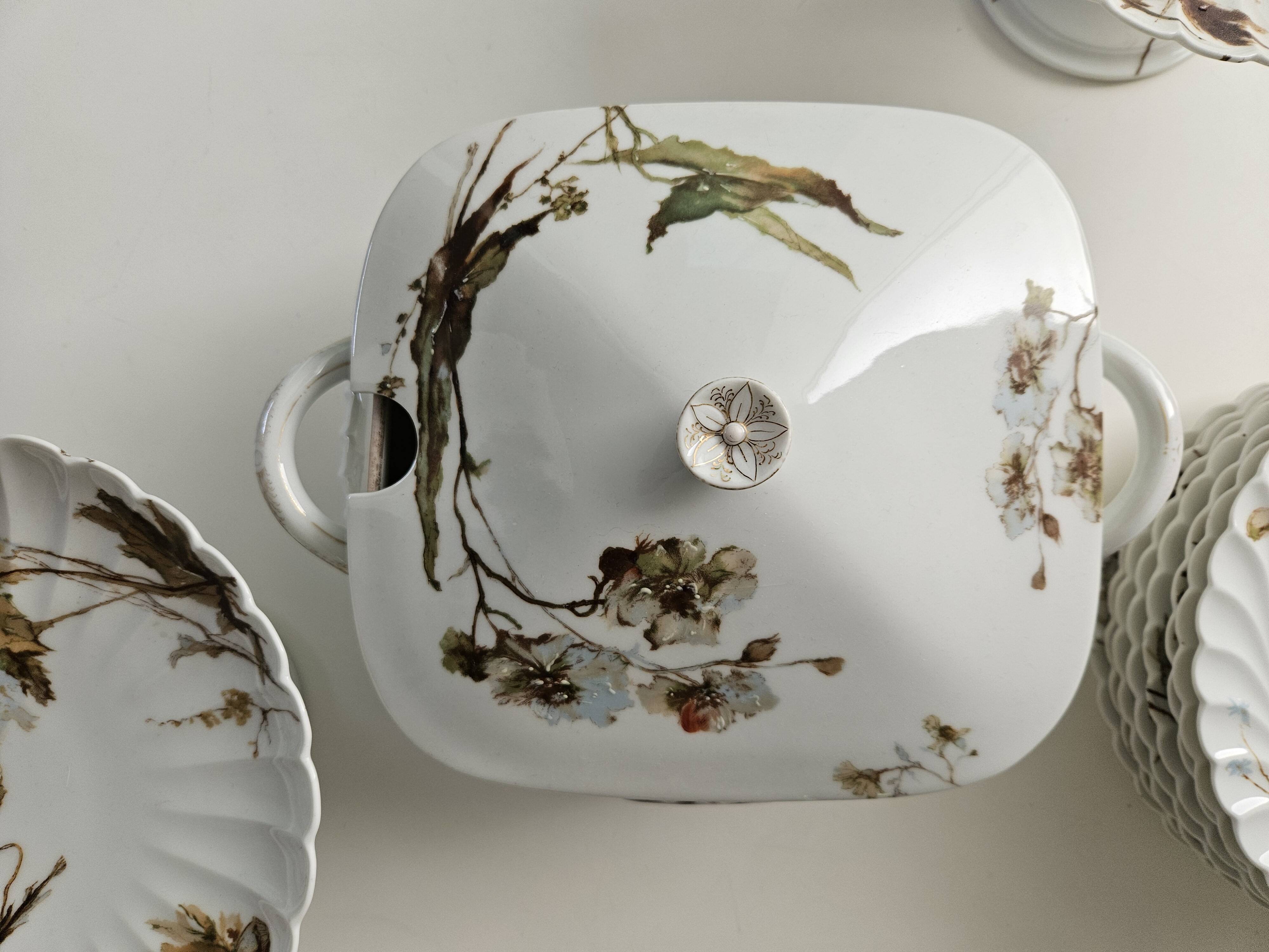 Haviland service plates, dishes on pedestals and soup tureen