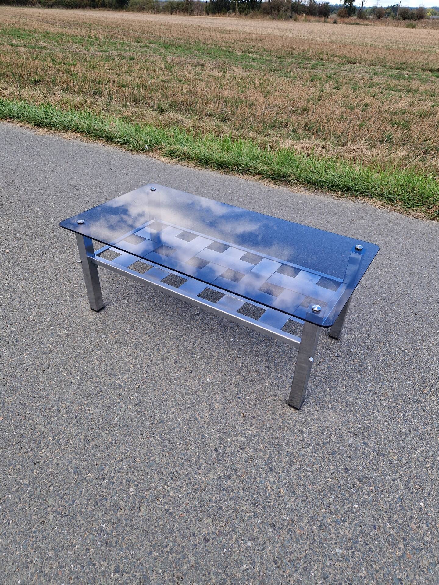 Stainless steel and smoked glass coffee table