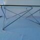 Tempered glass coffee table, intertwined legs design