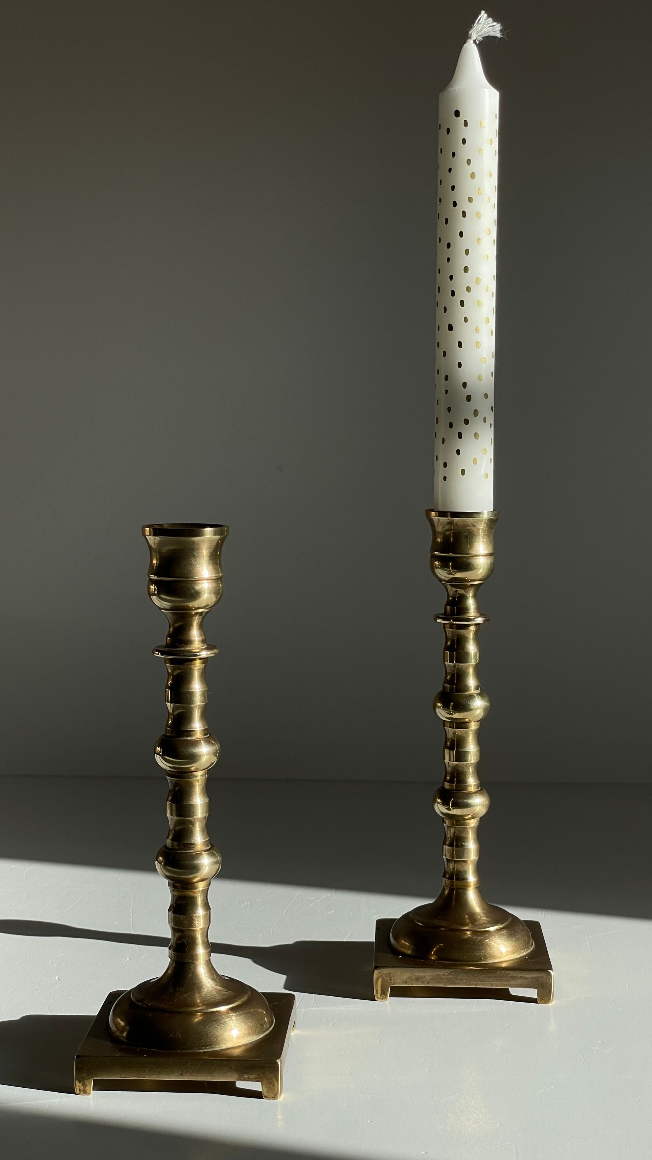 Pair of brass candle holders made in England