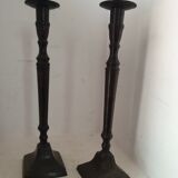 Two pairs of patinated brass candle holders