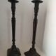 Two pairs of patinated brass candle holders