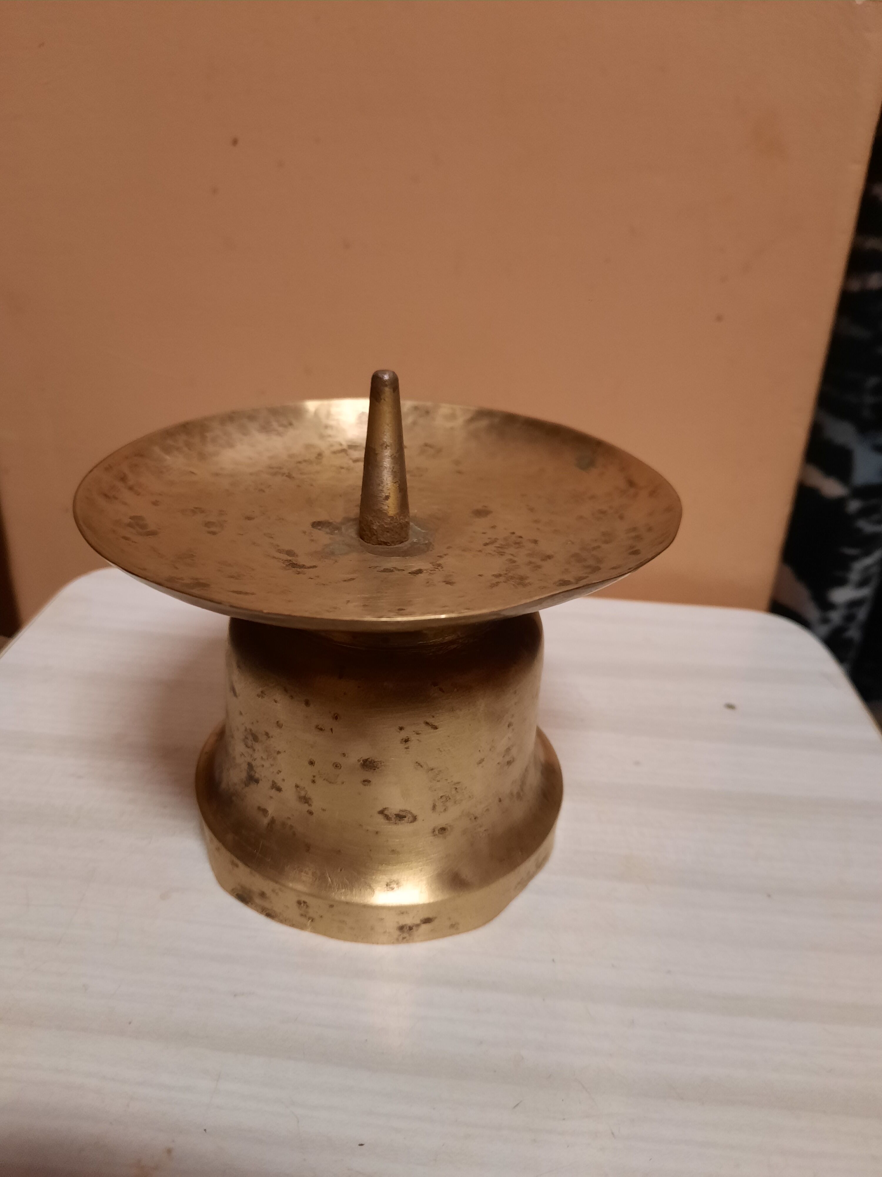 Brass candle pique