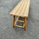 Vintage 1950s set: large table with tripod base and benches in woven chestnut