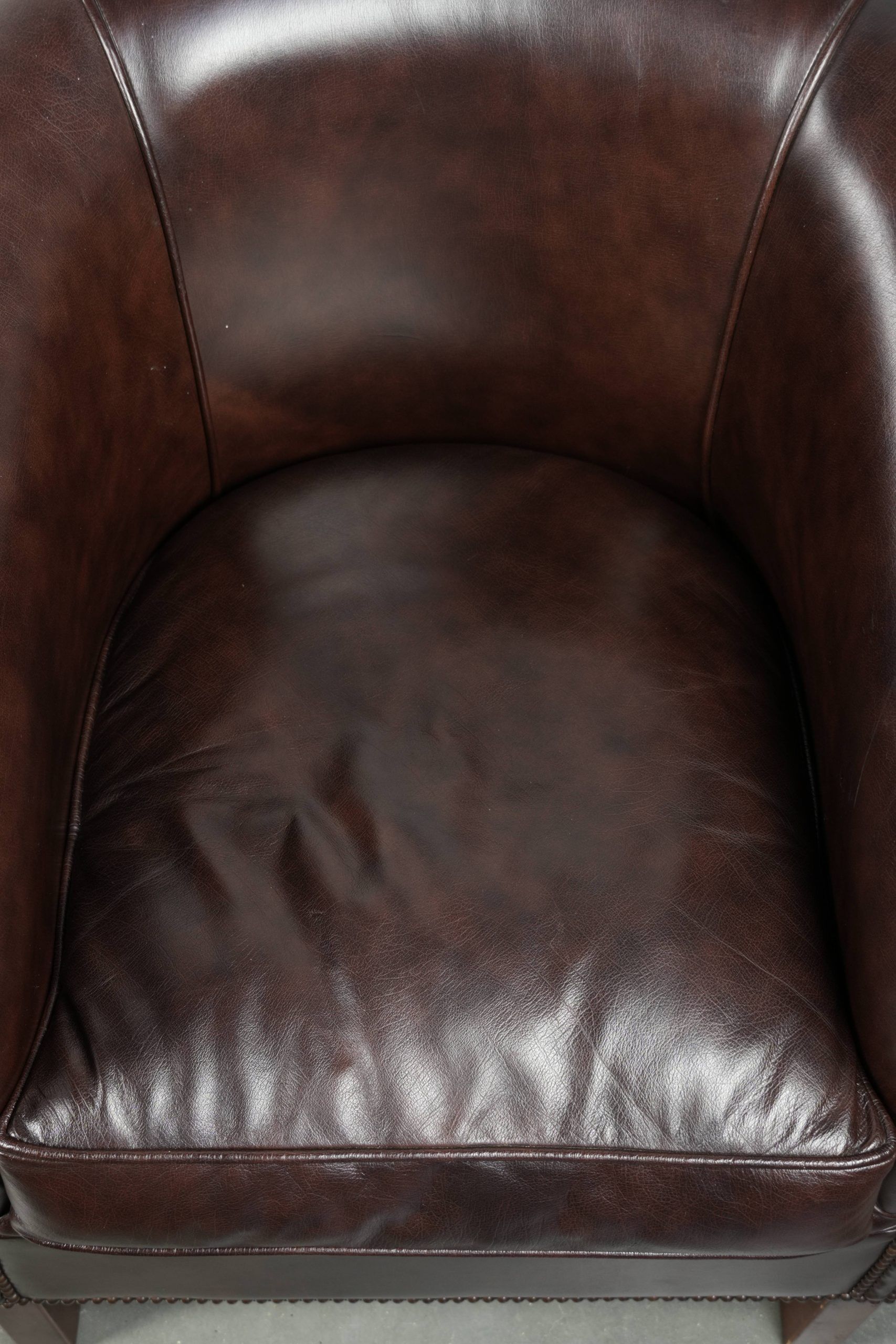 Set of two cowhide club armchairs in good condition with a English design