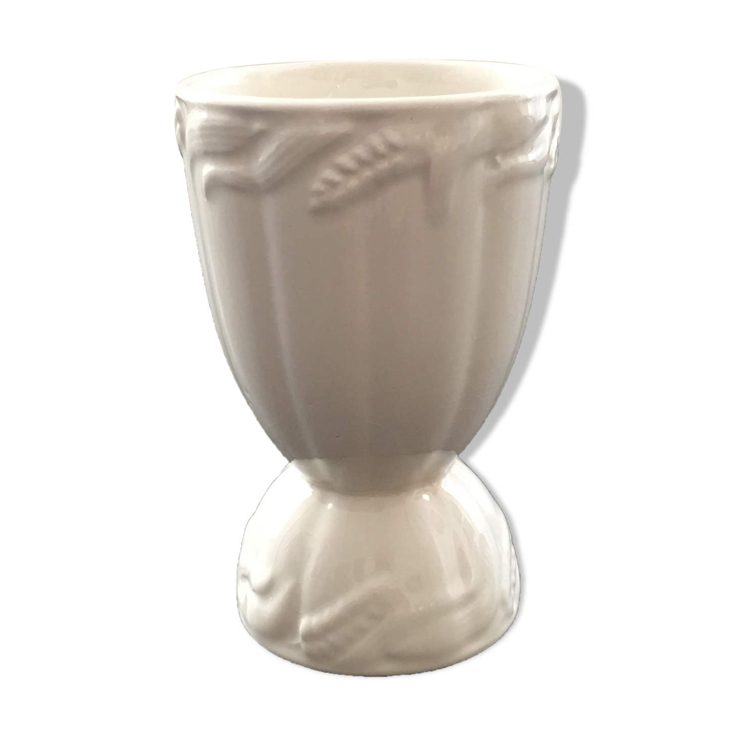 White vase with wheat decoration.