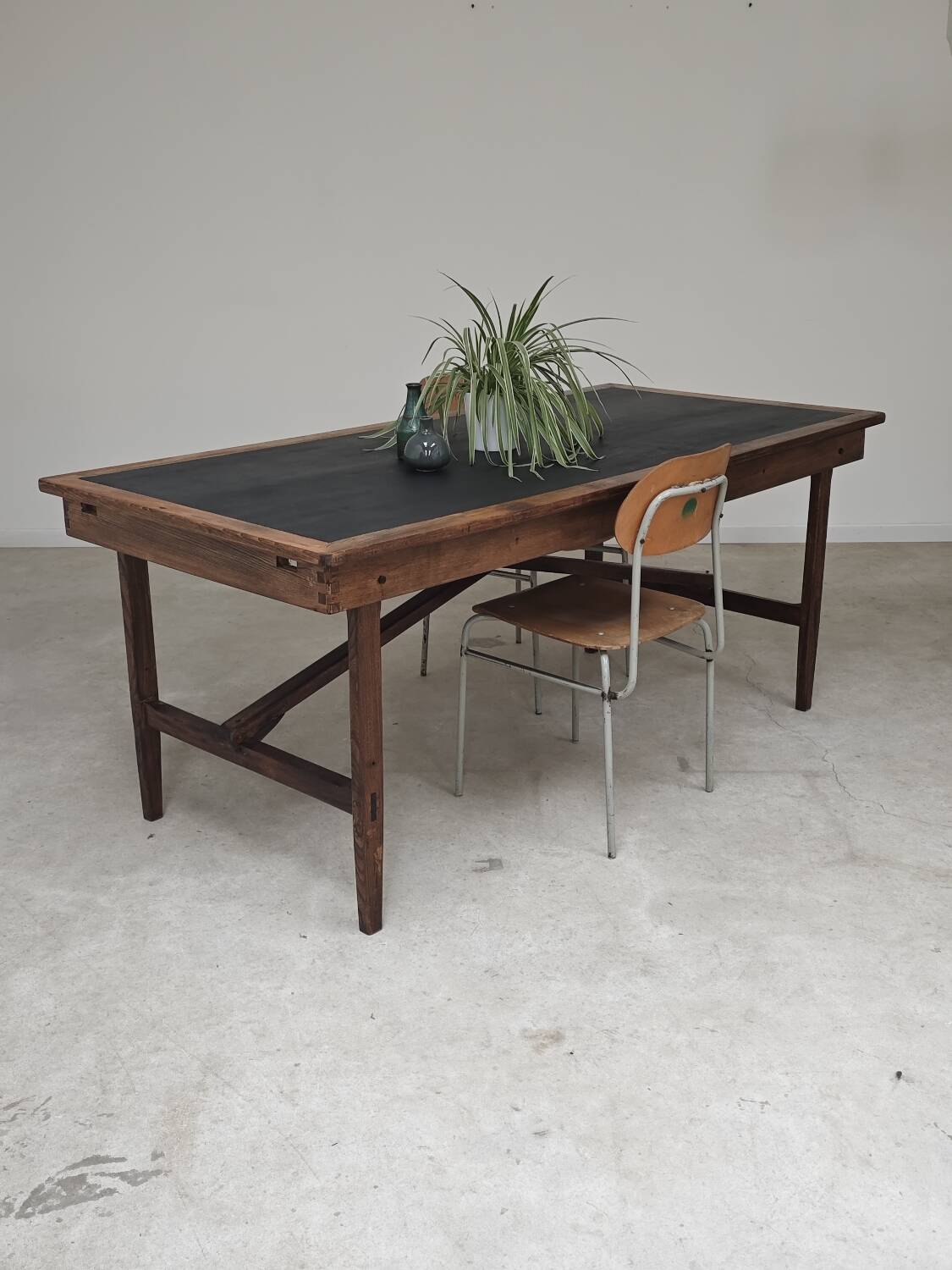 Vintage workshop folding table in oak with a hand-patinated black top.