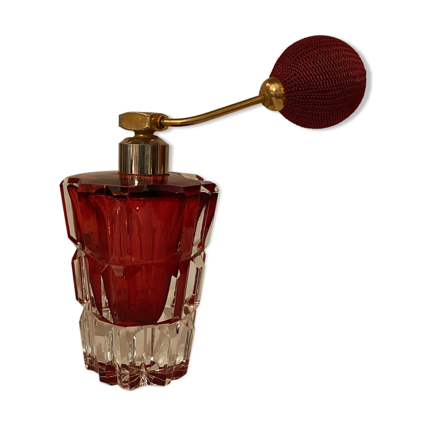 Red crystal perfume spray and red pump.