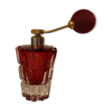Red crystal perfume spray and red pump.