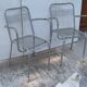 Pair of open metal armchairs