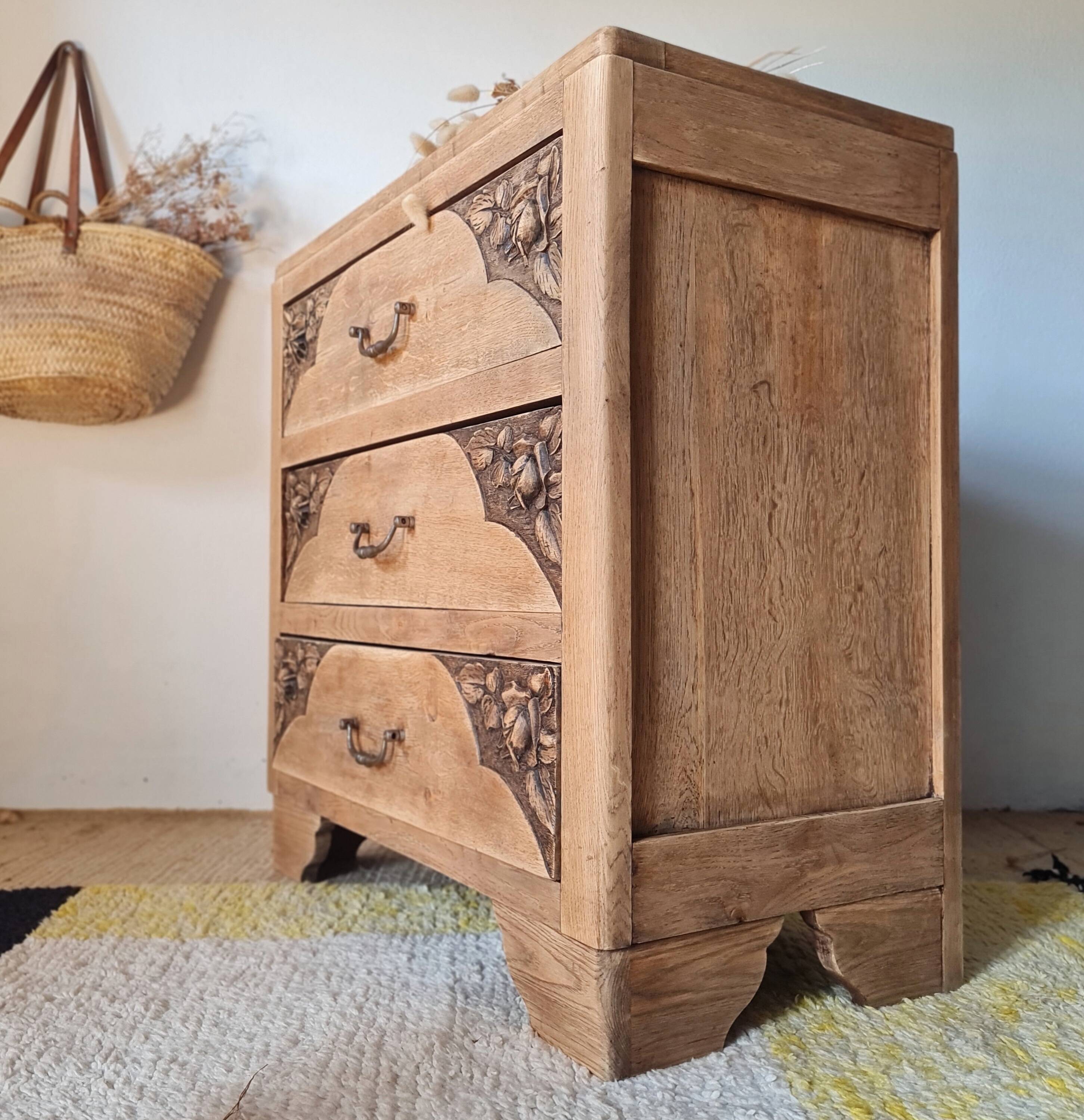 Art Deco chest of drawers in raw oak with carved drawers.