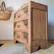 Art Deco chest of drawers in raw oak with carved drawers.