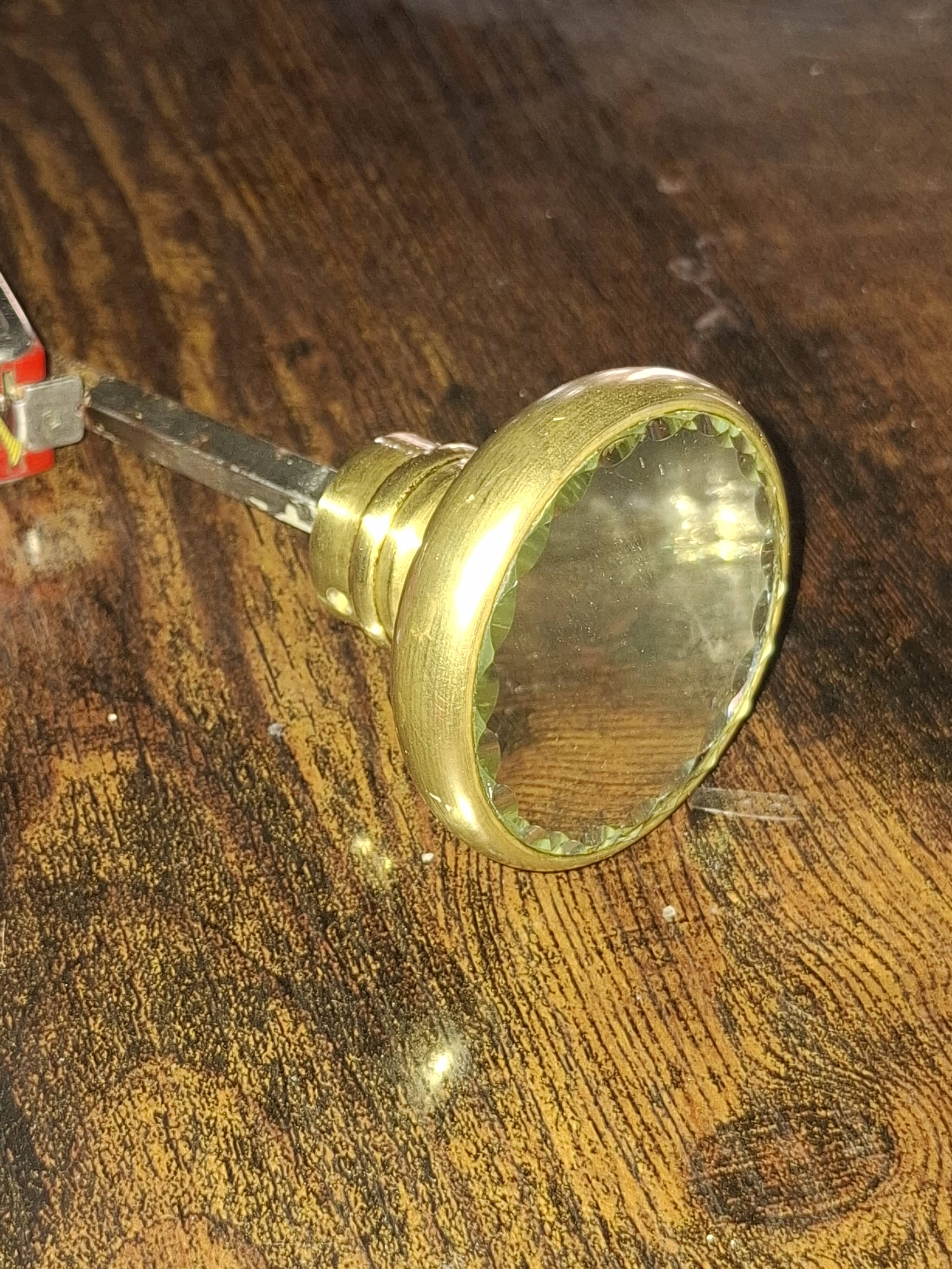Sublime door handle made of brass with a bevelled mirror front.