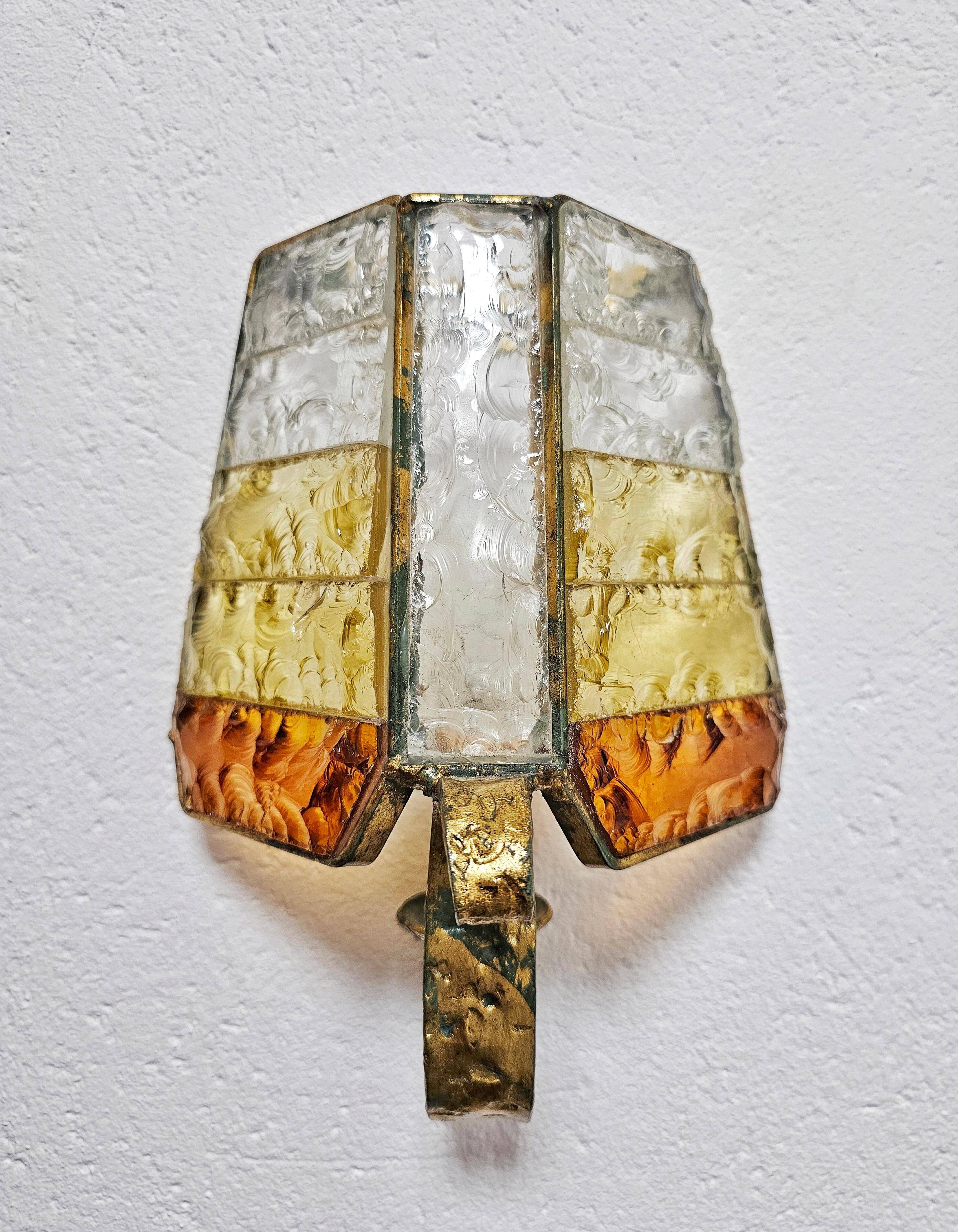 Brutalist pair of wall sconces in hammered glass by Longobard 1970.