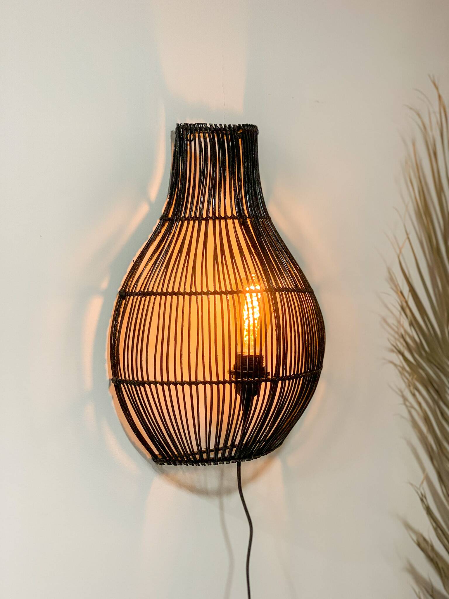 Black rattan wall light