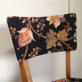 2 black scandinavian chairs and flowers