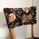 2 black scandinavian chairs and flowers