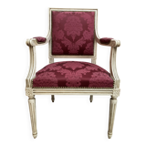 Louis XVI style armchair in patinated wood and damask fabric