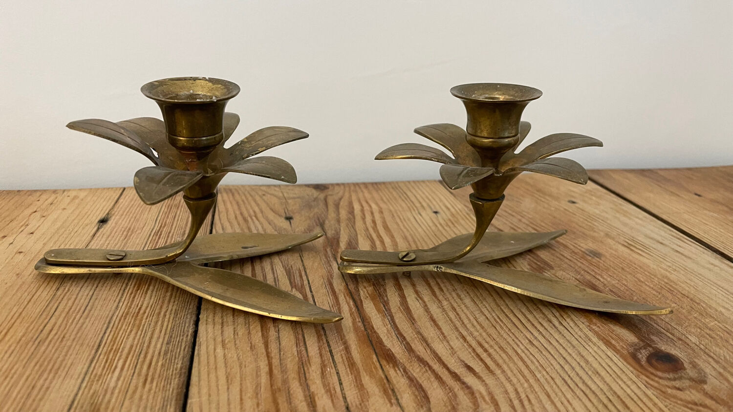 Pair of brass flower candlesticks
