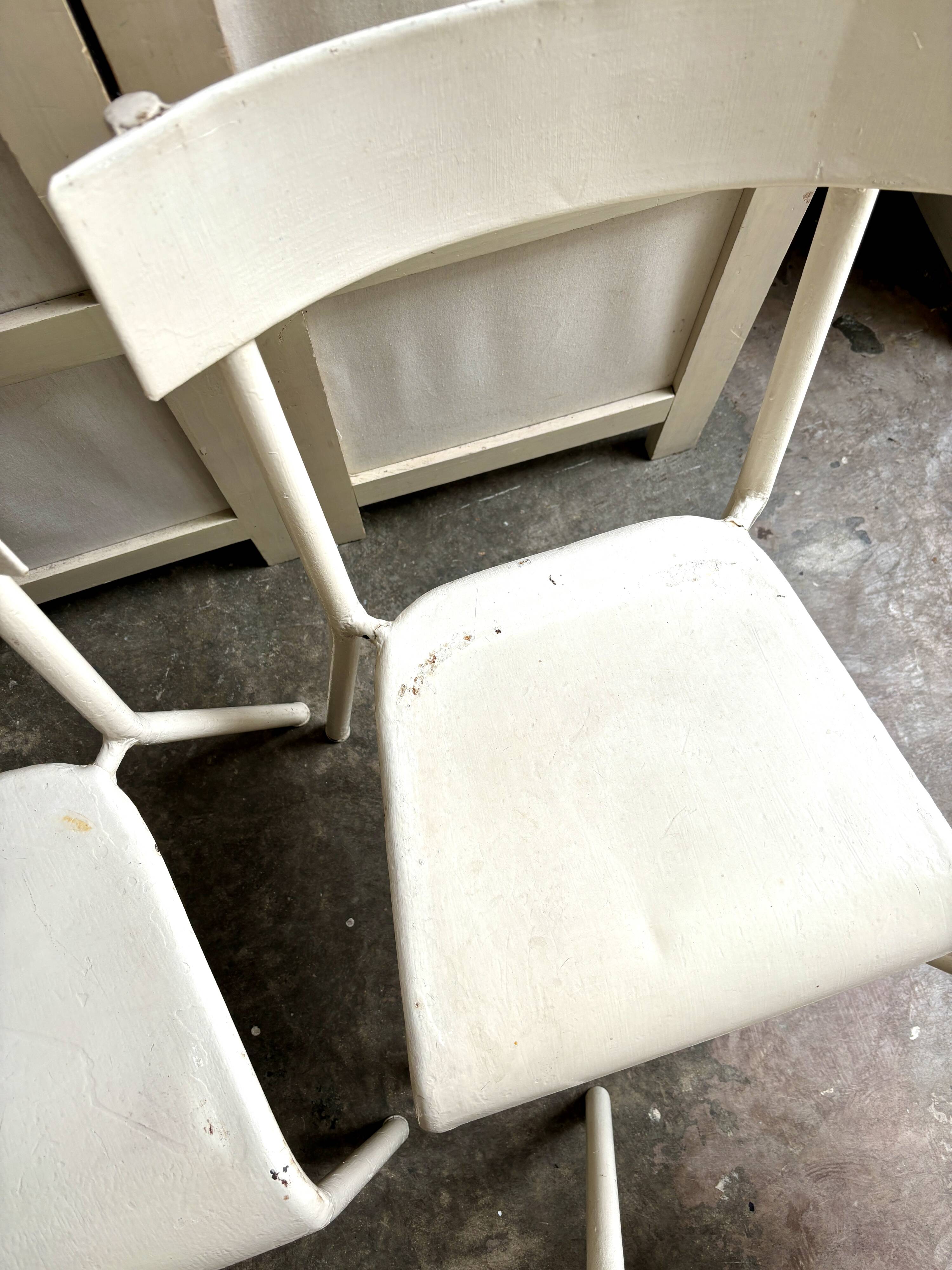 4 beige metal garden chairs