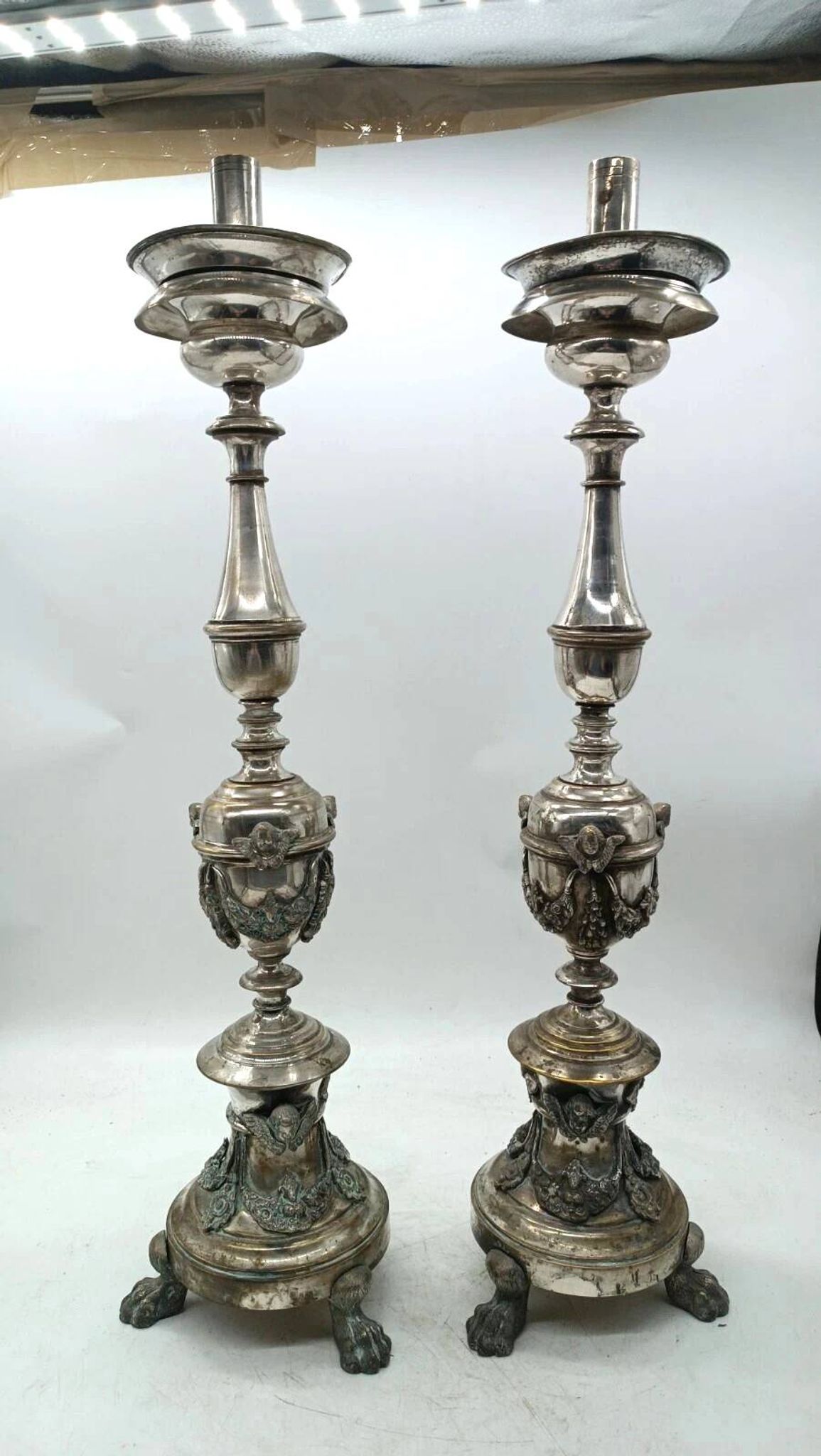 Pair of silver-plated bronze candlesticks in the Empire style, early 19th century, height 70 cm