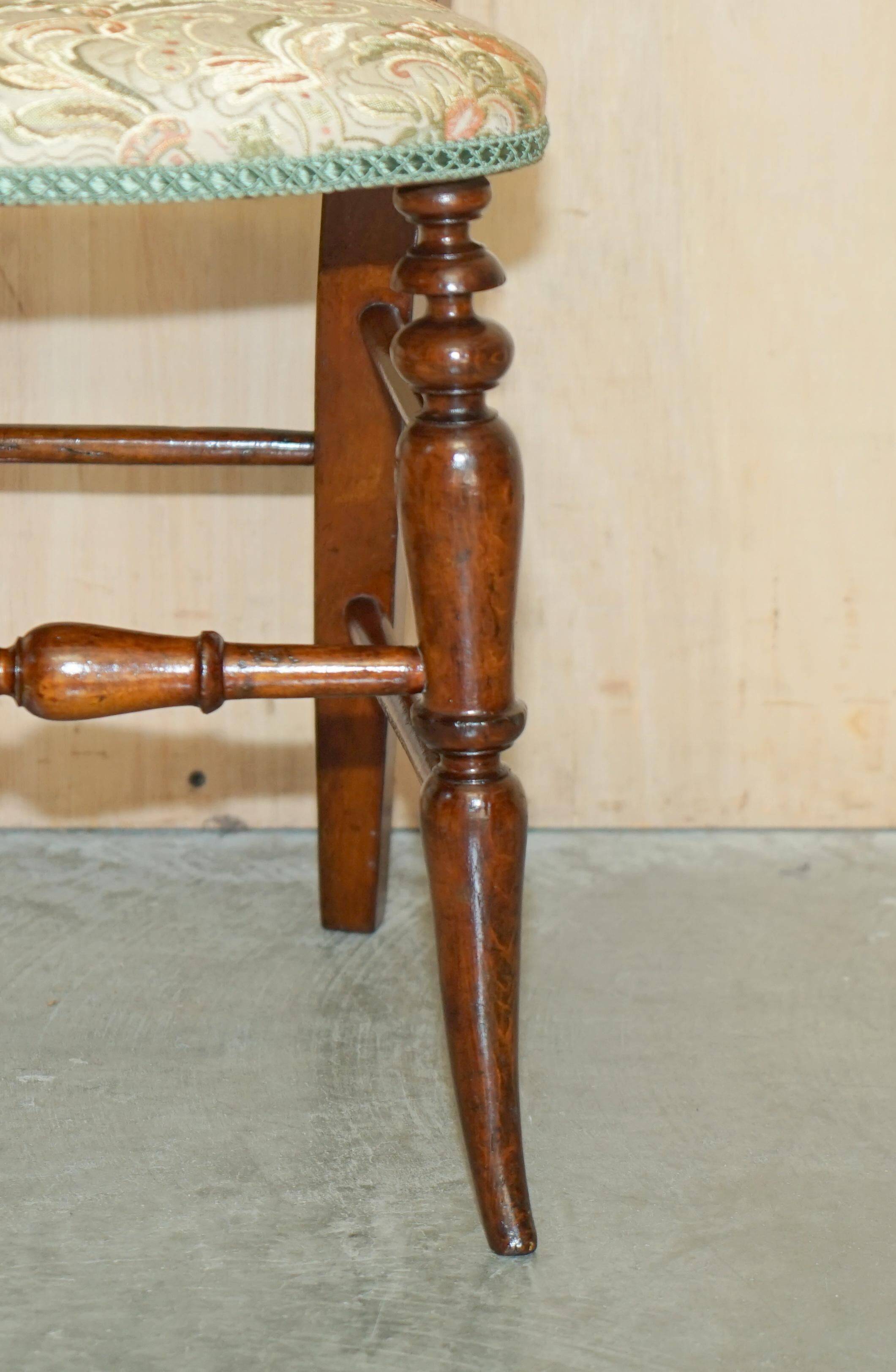 Victorian walnut dressing table chair from around 1880 with a medallion on the backrest.