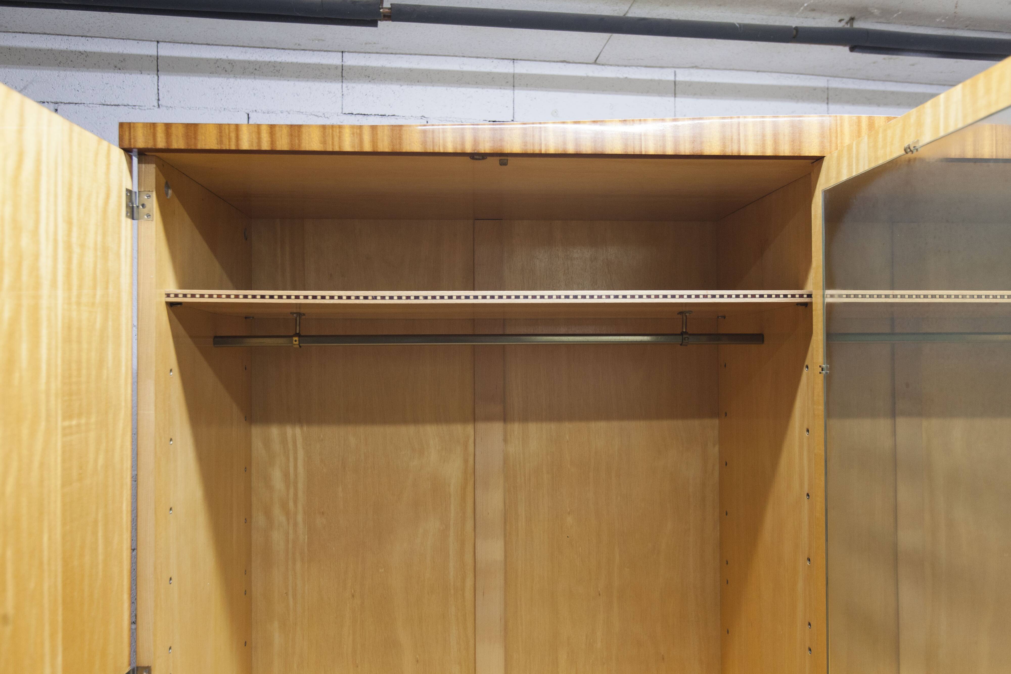 1960s Scandinavian wardrobe, blonde varnished wood, unusual, 4 doors, 3 drawers, 7 shelves.
