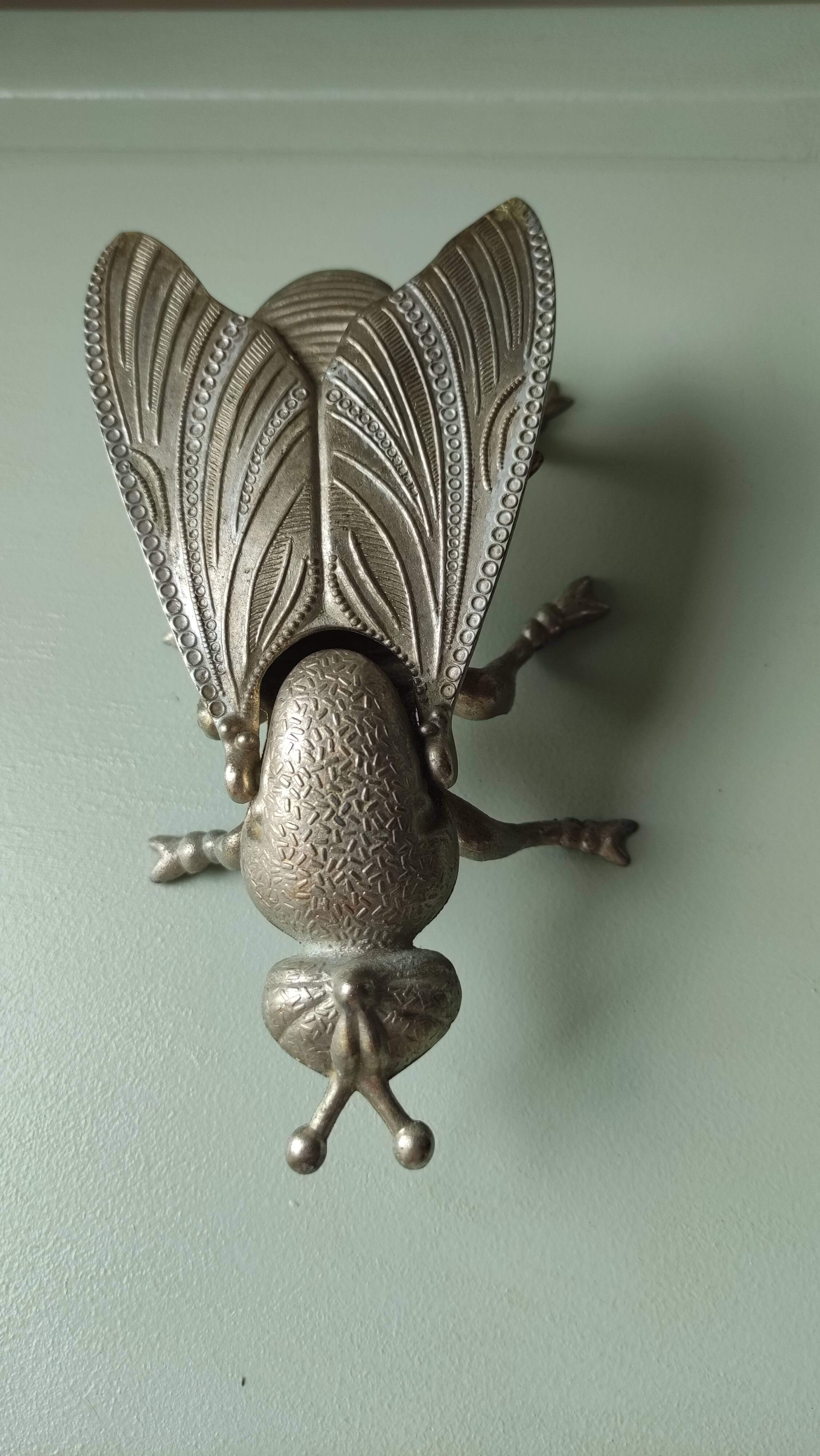Vintage metal fly, old ashtray to divert