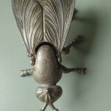 Vintage metal fly, old ashtray to divert
