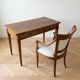 Antique office set: wooden table and matching armchair.