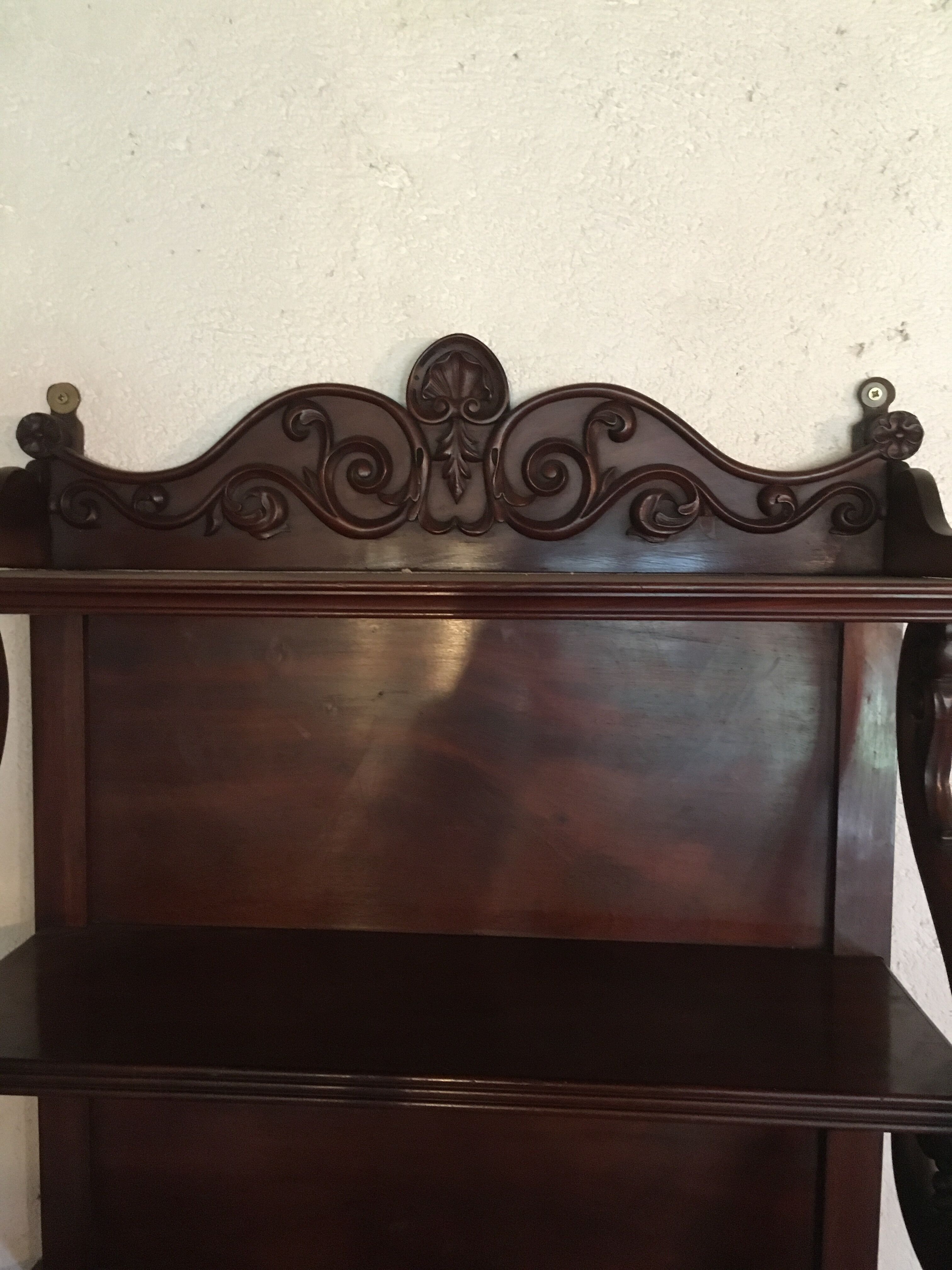 Carved wooden wall shelf.