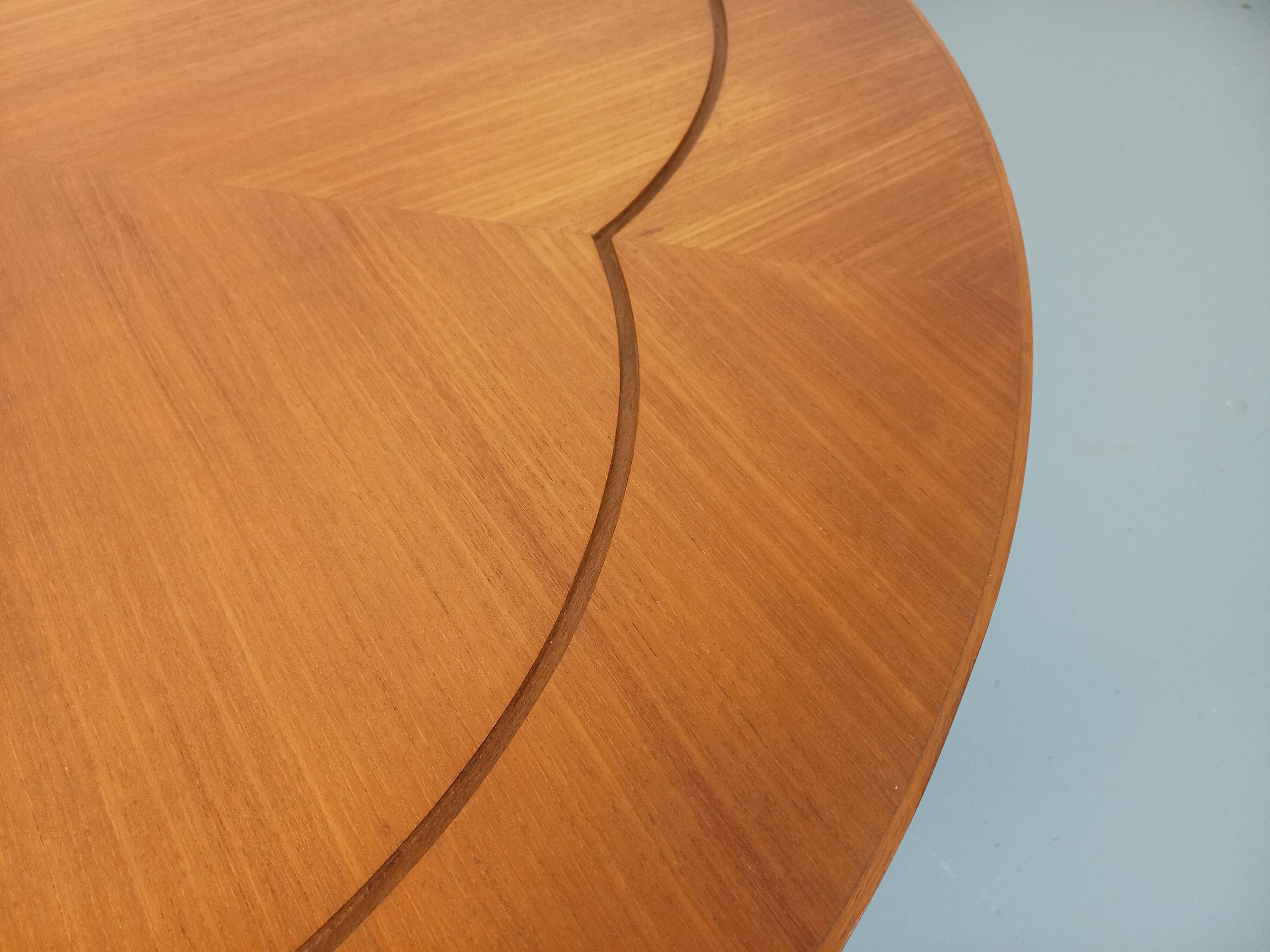 Vintage English round teak coffee table from the 1960s