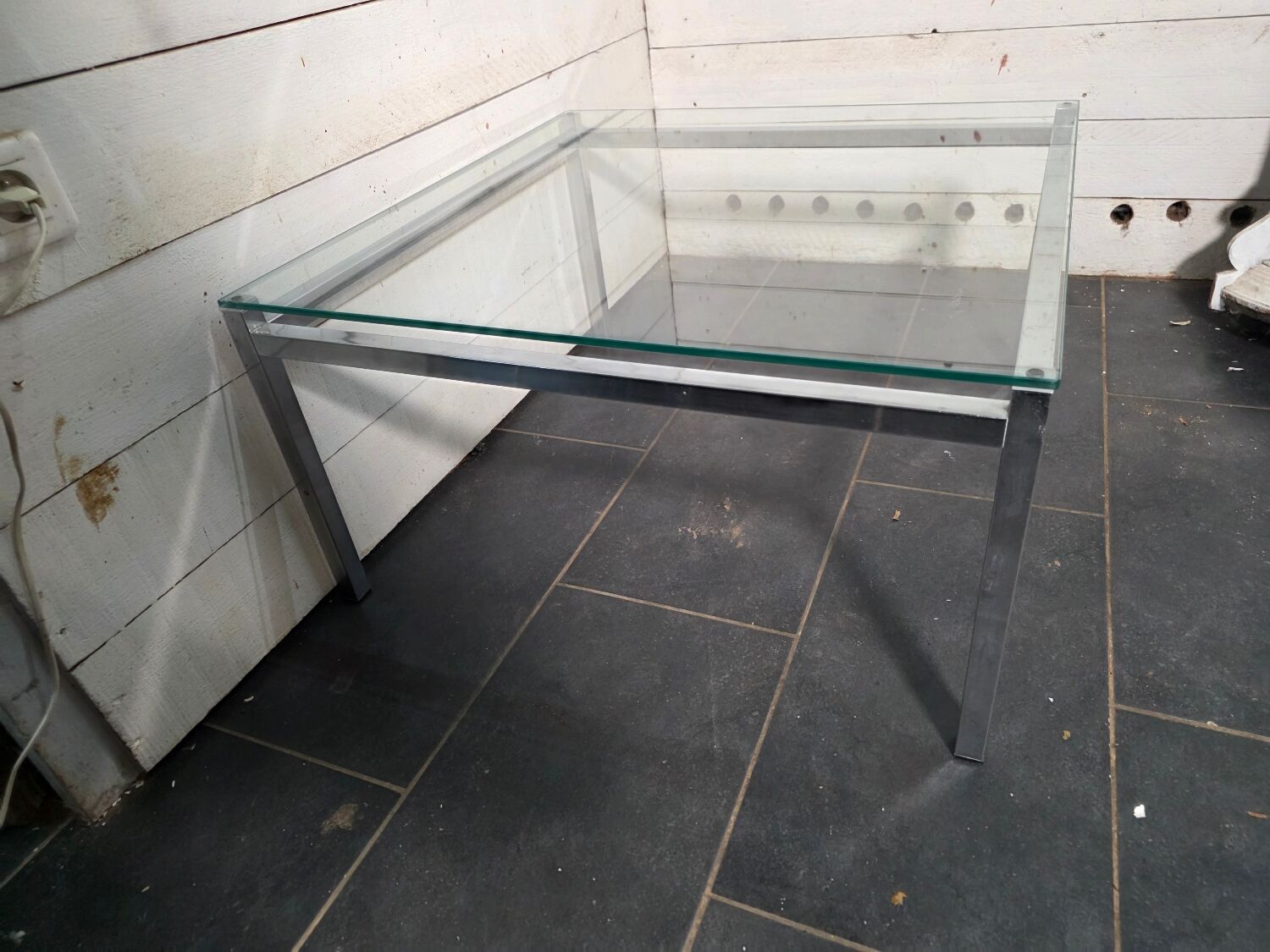 Chrome metal coffee table with a glass top from the 1970s.