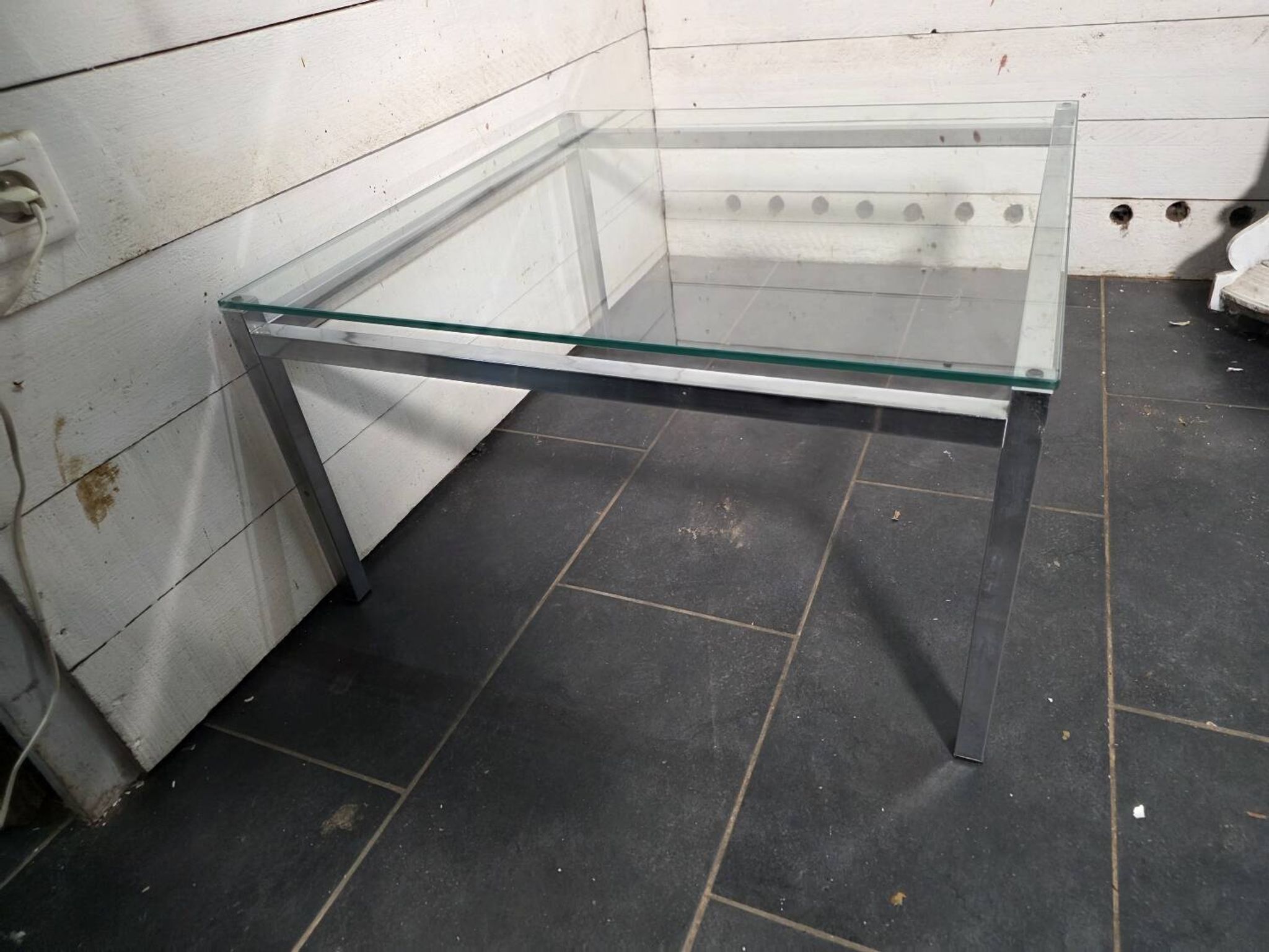 Chrome metal coffee table with a glass top from the 1970s.