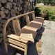 Baumann bench with wooden frame and faux leather seat.