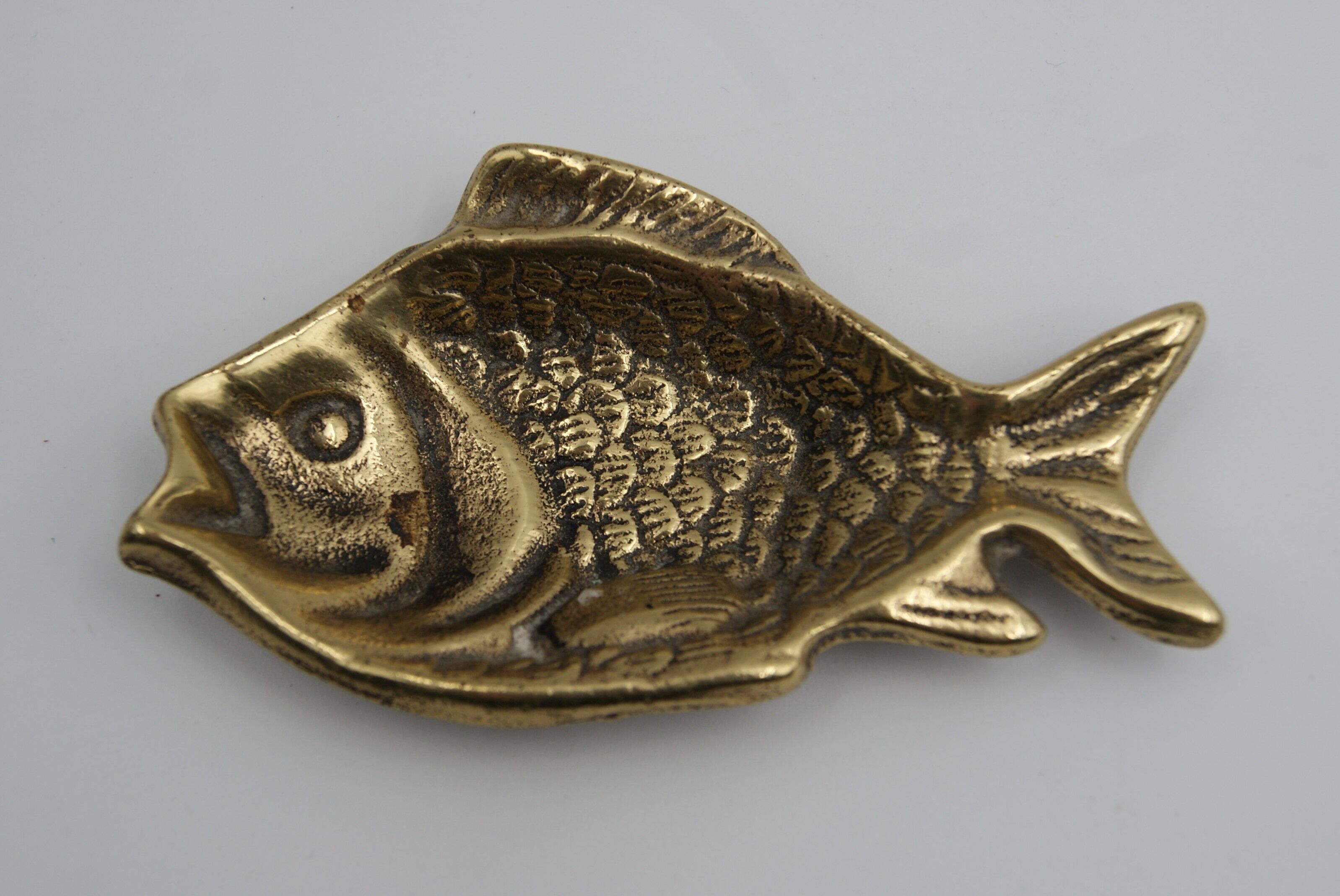 Empty bag brass fish England