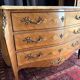 Commode galbée en marqueterie de style Louis XV, signée Marquant