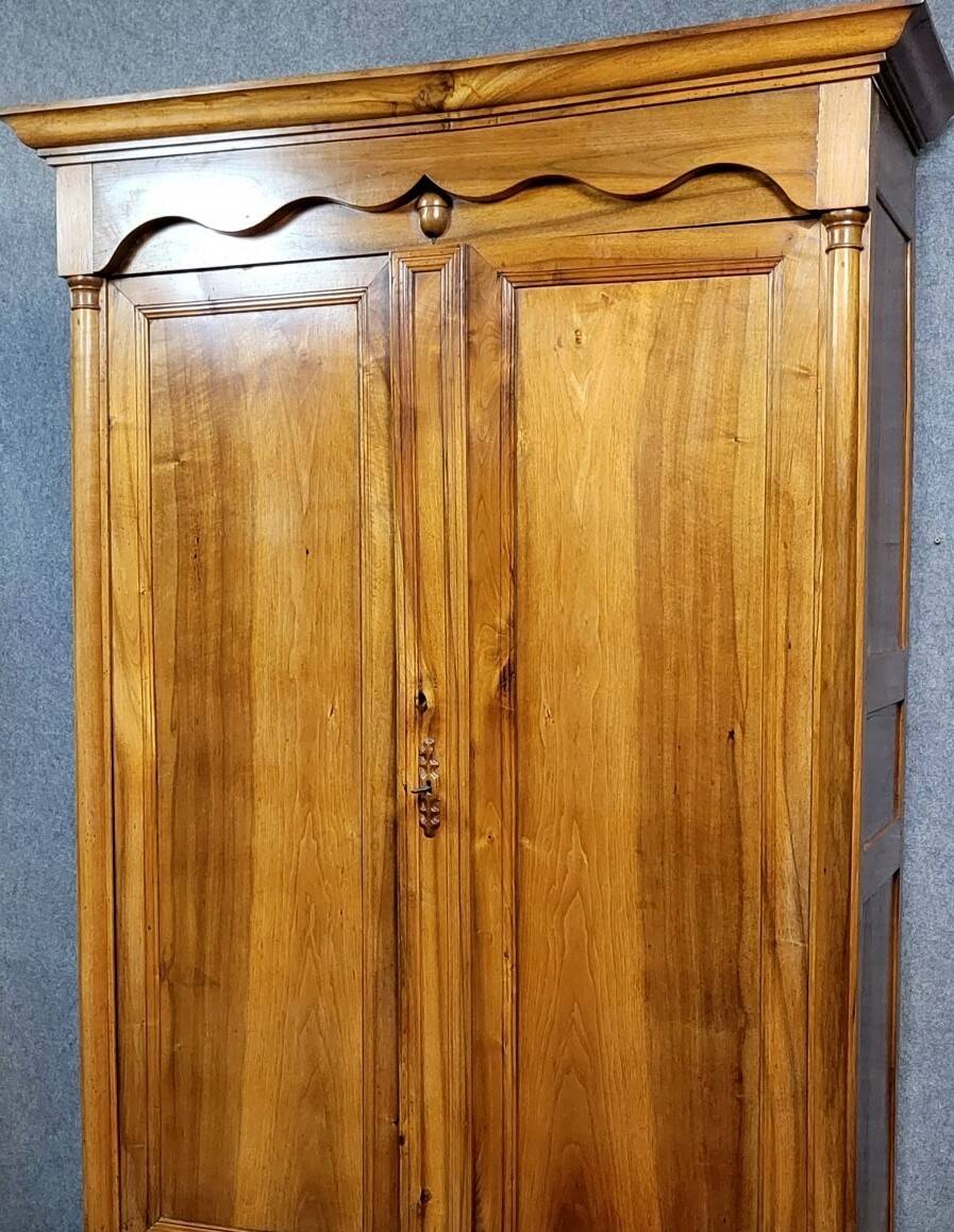 Empire period wardrobe, made of solid walnut, dating from the early 19th century.