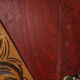 Red wooden wall-mounted coat rack and Art Deco mirror