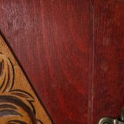 Red wooden wall-mounted coat rack and Art Deco mirror