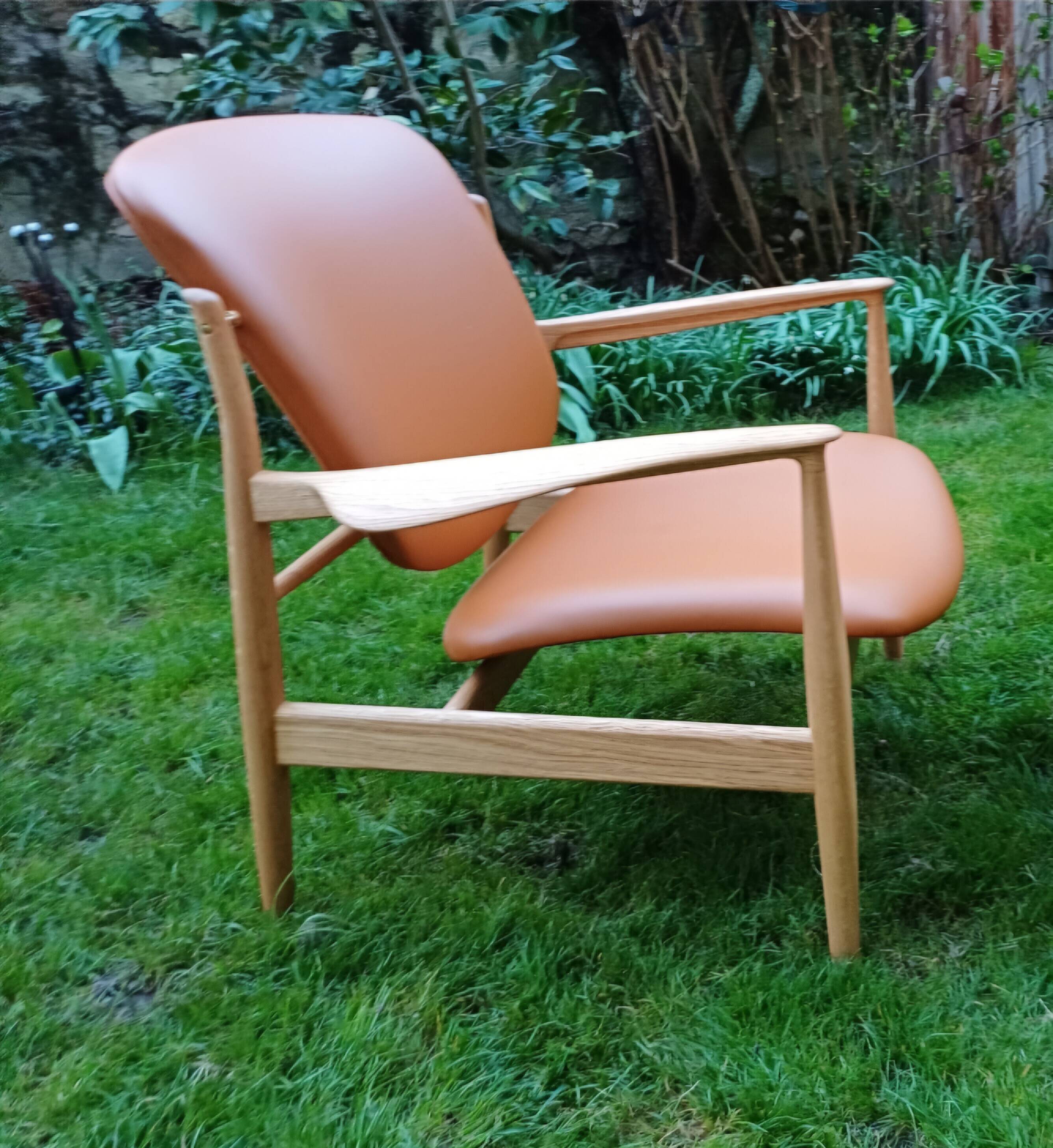 2 "The French Chair" seats by designer Finn Juhl and 1 matching footrest.