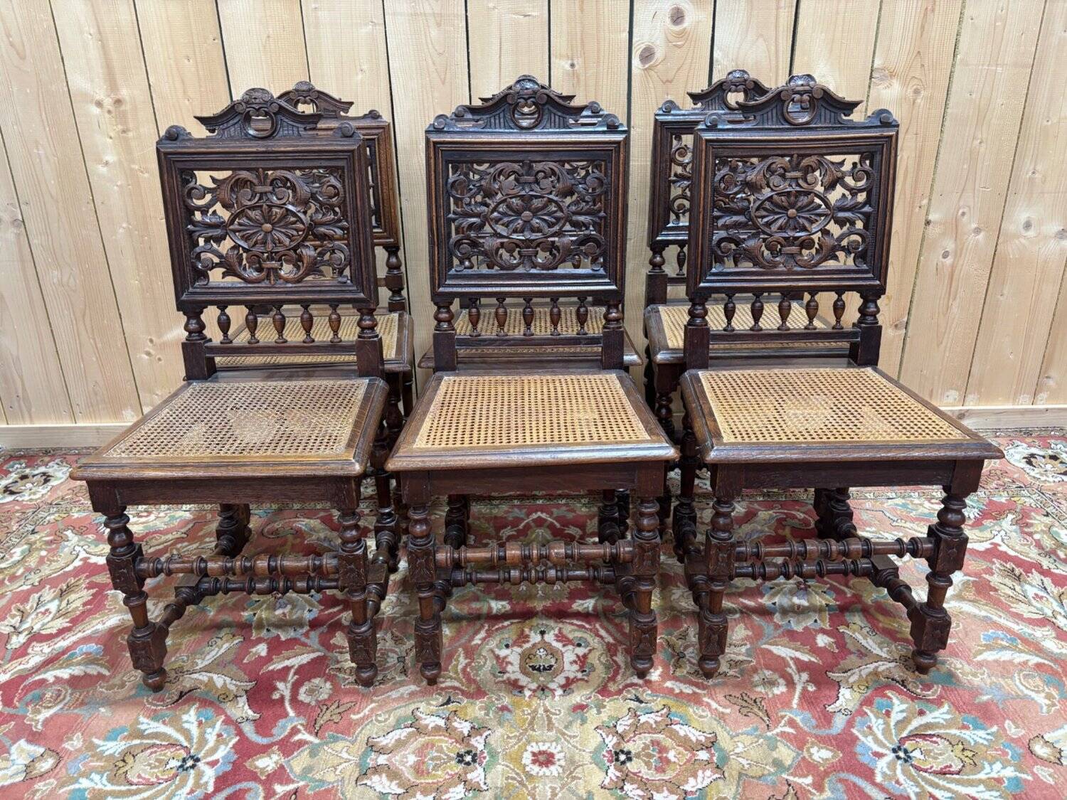 6 High Era chairs in carved solid oak and rattan caning.