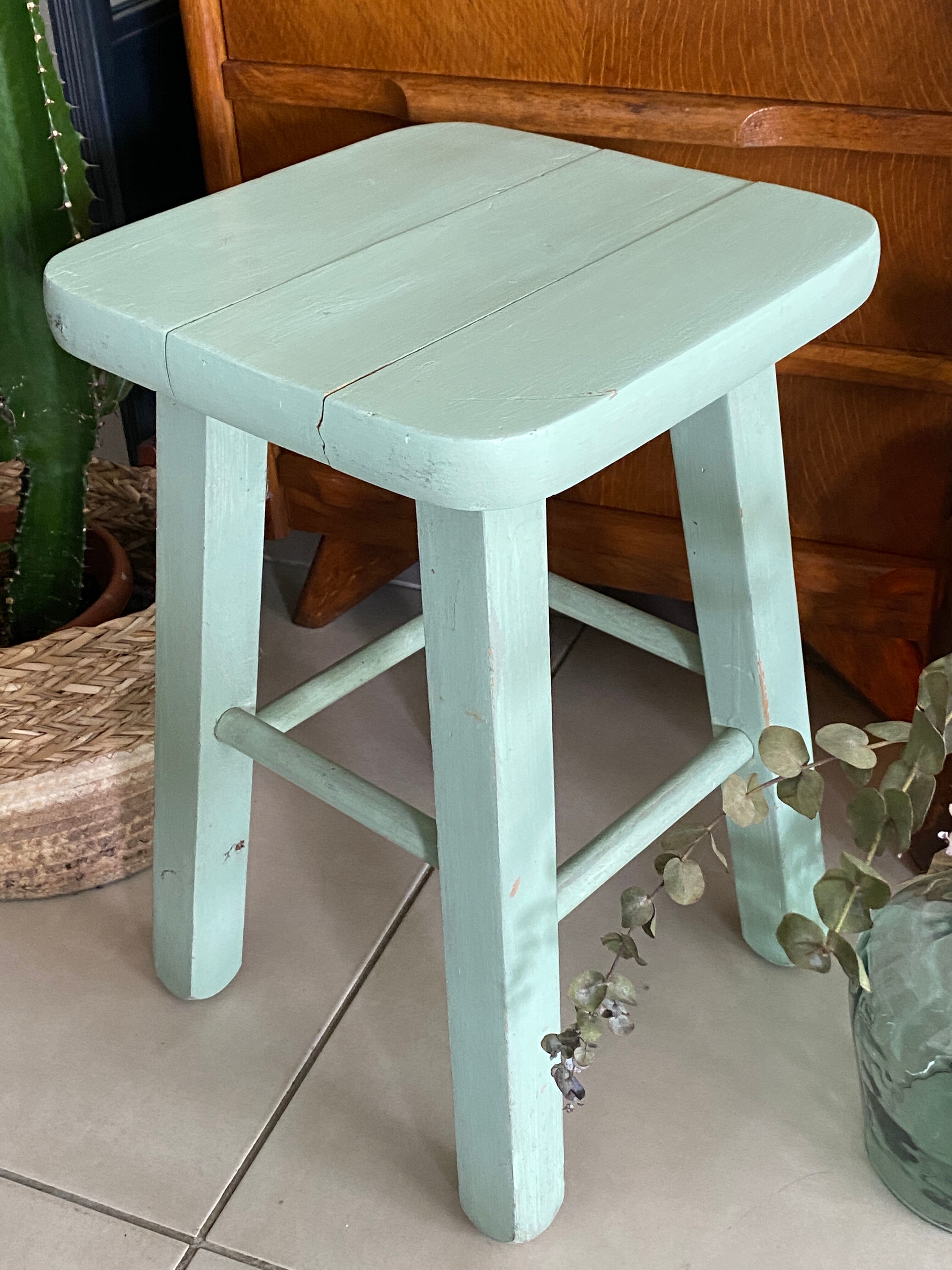 Old almond green wooden stool