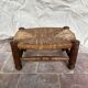 Rustic footrest made of wood and straw